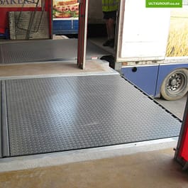 Hydraulic dock levellers are stored in the dock pit and provide a smooth transition between trailer and dock