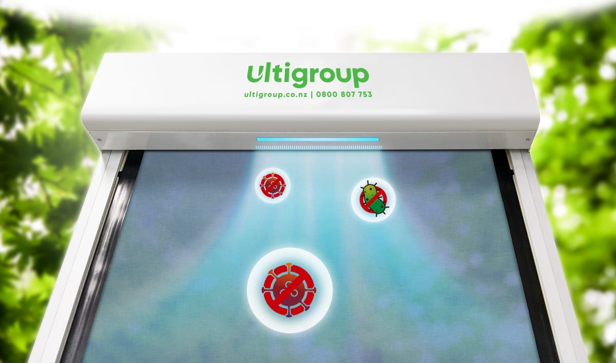 Ulti Group industrial door head unit with integrated UV-C hygiene control light sanitising a door curtain.