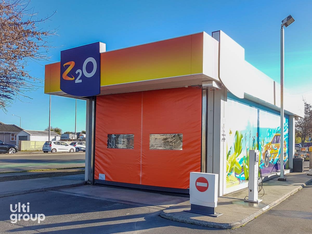 Orange Ulti Group rapid roll door installed on a Z carwash bay.
