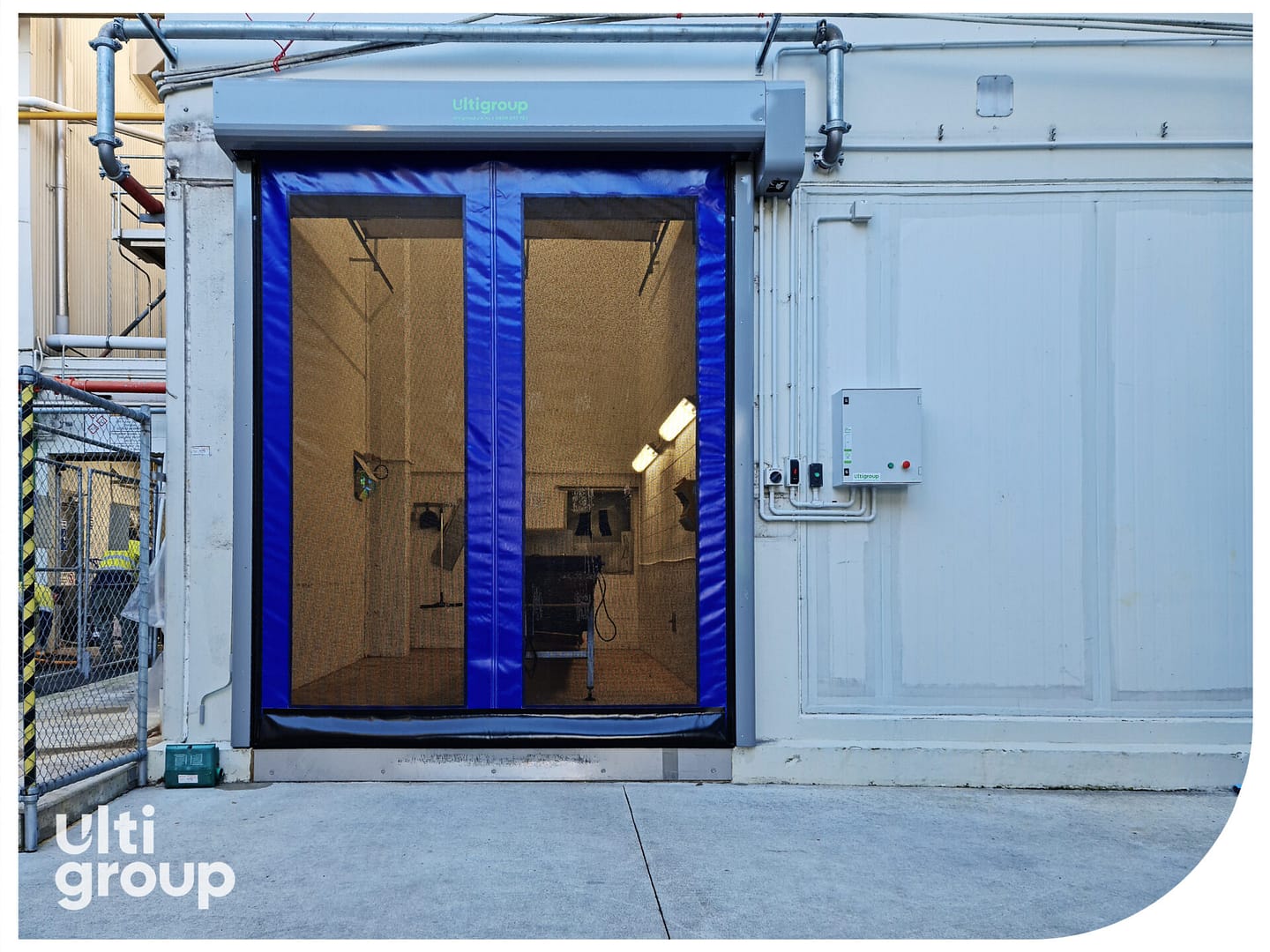 Blue Ulti Roll ventilated door installed on an exterior wall.