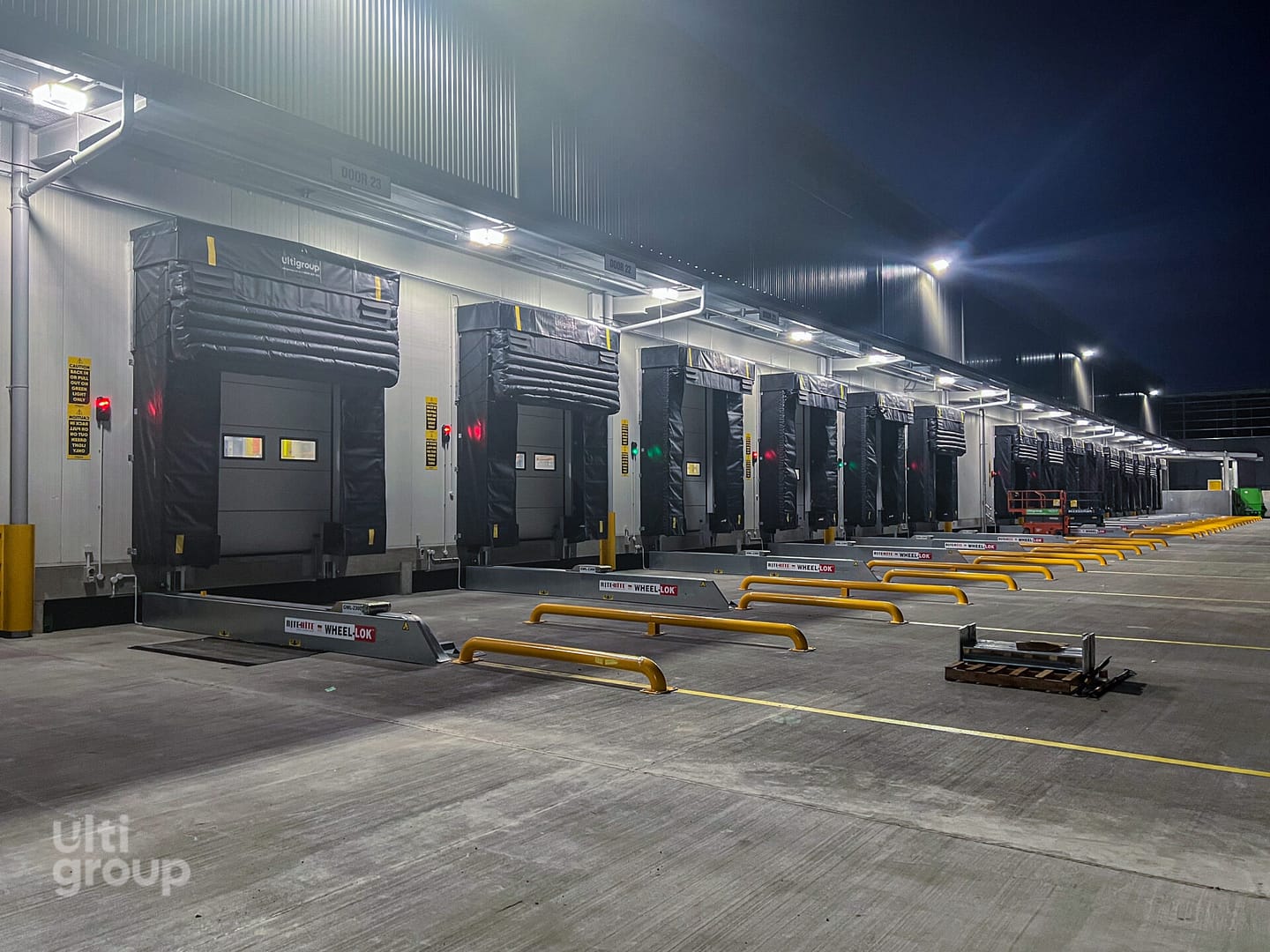 Row of loading docks with Ulti Group seals and Rite-Hite Wheel-Lok restraints.