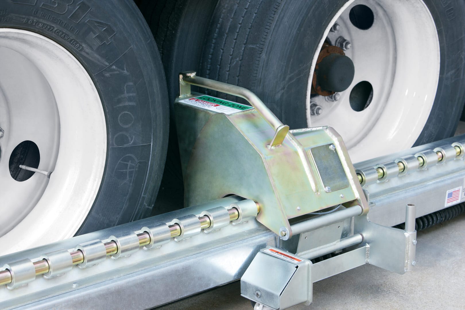 Rite-Hite wheel restraint system locking a truck tyre at a loading dock.