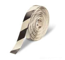 Roll of black and white diagonal hazard warning tape.