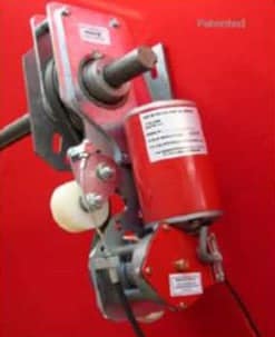 Industrial door motor and drive assembly with red housing and metal brackets.