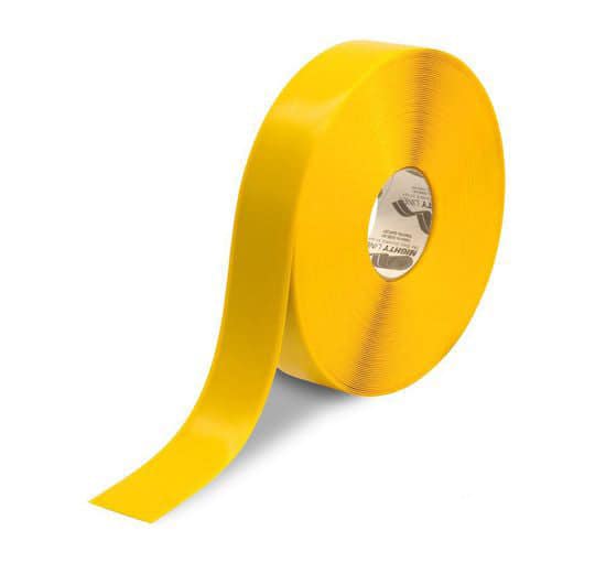 Roll of solid yellow industrial floor marking tape.