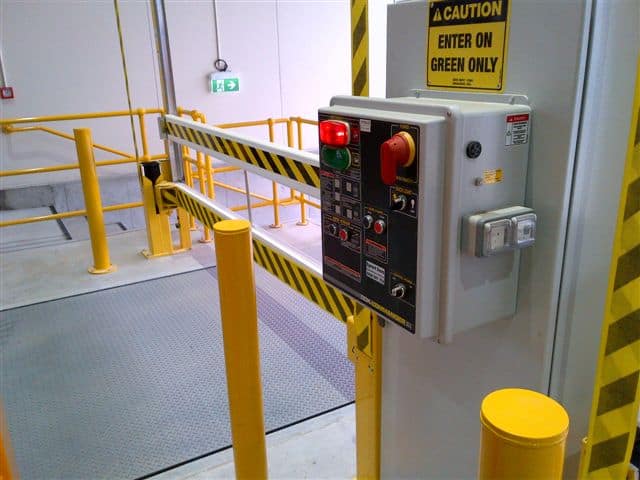 Dock Commander control panel and yellow Safe-T-Gate at a loading dock.