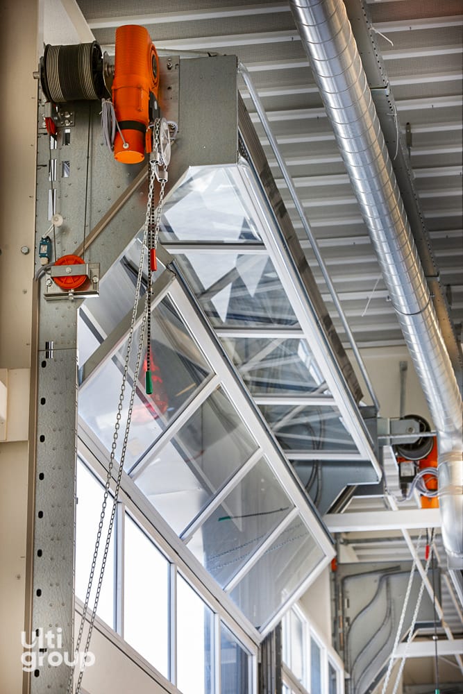 Internal view of a compact fold-up door mechanism and glazed panels.