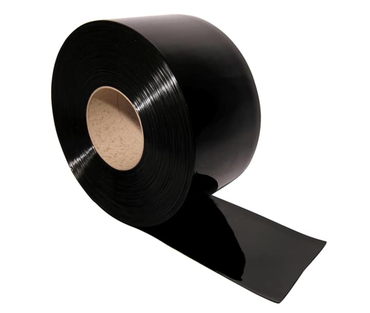 A large roll of black PVC strip material on a cardboard core.