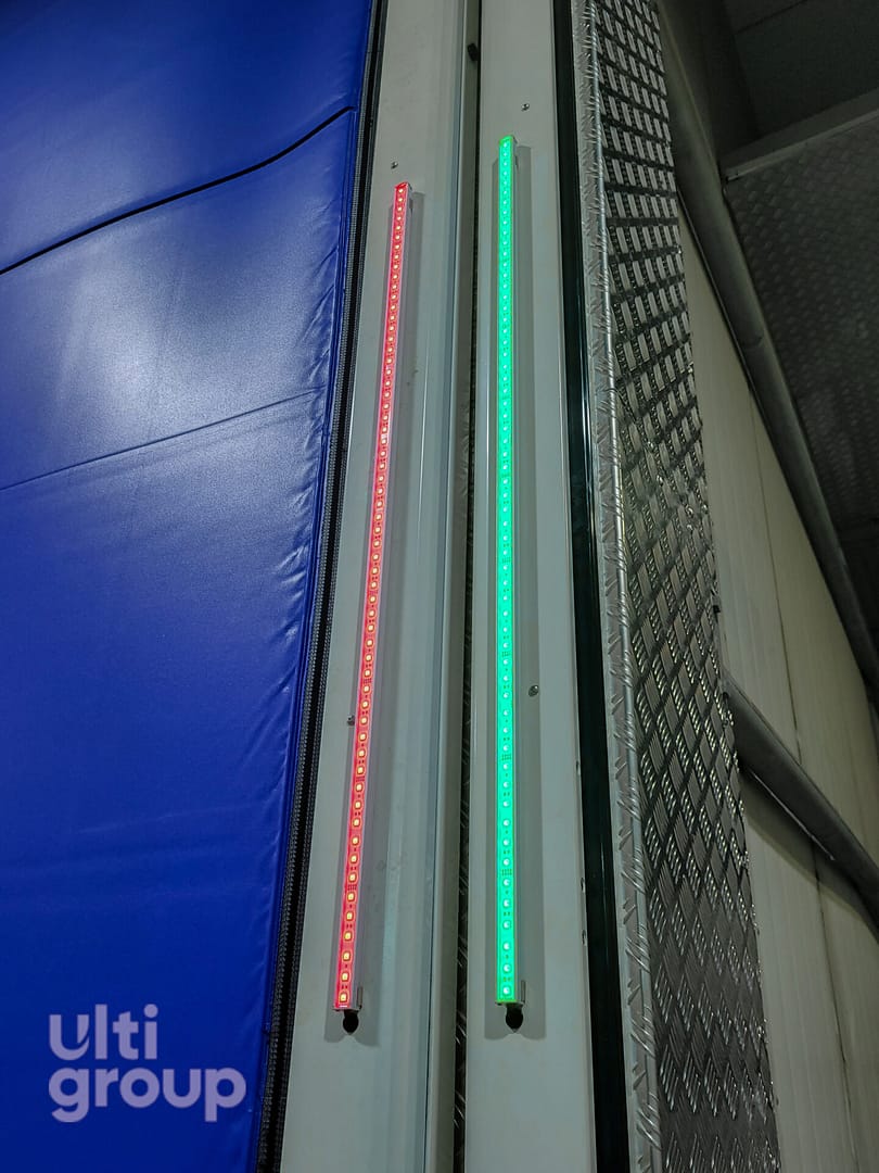 Red and green LED indicator strips on an industrial door frame.