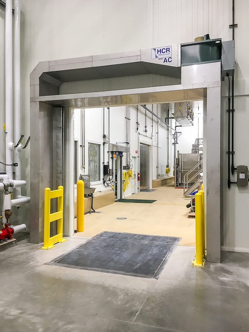 HCR Model AC air door installed in a food processing facility doorway.