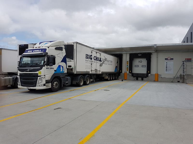 Big Chill truck parked at a loading dock with an Ulti Group dock seal.