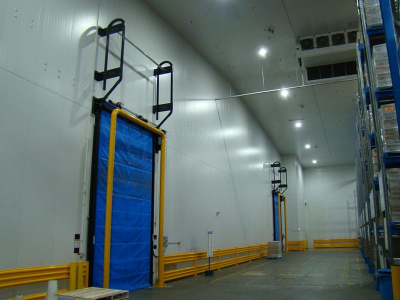 Blue FasTrax FR Door installed in a cold storage warehouse facility.