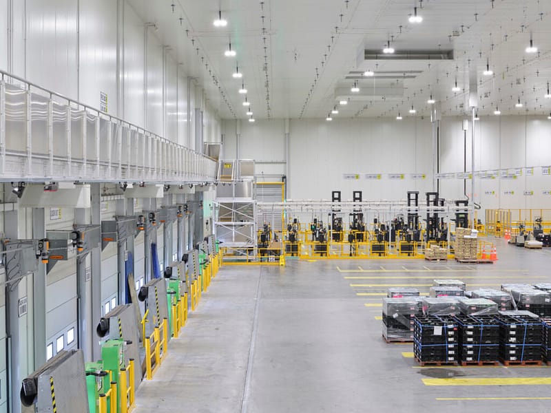 Vertical Storing Dock Levellers and loading bays in a distribution centre.