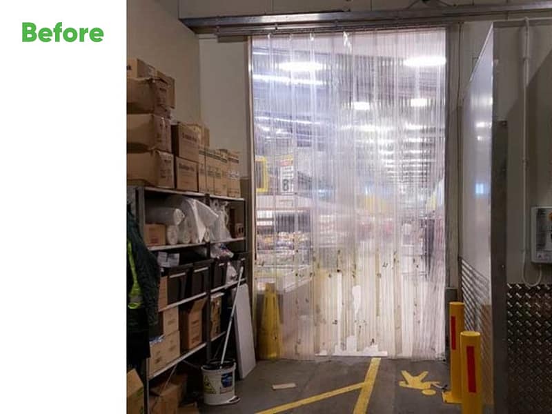 Clear PVC strip curtain installed in a warehouse doorway.