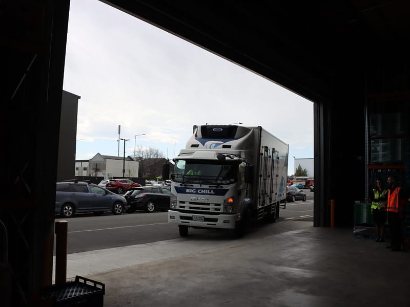 A Big Chill refrigerated truck parked at a warehouse loading bay.