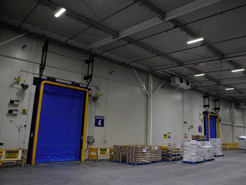 Blue Fastrax FR Door installed in a cold storage warehouse facility.
